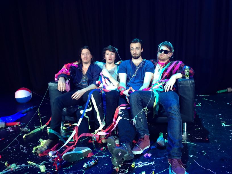 Cast of Hedonism's Second Album sitting on a couch
